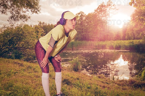 Young woman jogging. Sunny evening. Fitness concept.