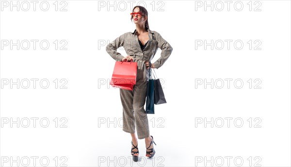 Stylish tall woman posing with packages. Concept for discounts