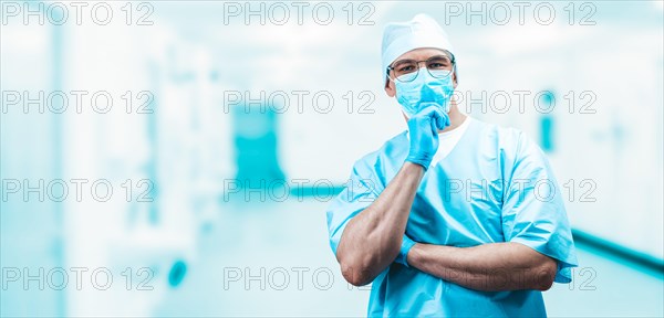 Portrait of a doctor in a mask in a hospital. Medicine concept.