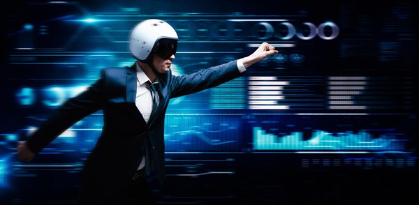 Portrait of a man in a suit and helmet. He shows that he is flying against the background of a futuristic hologram. Business concept. Internet technologies.