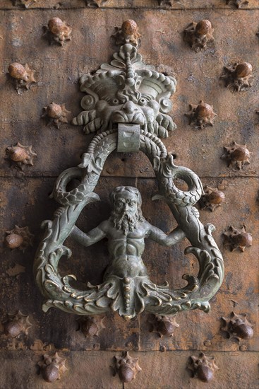 Historic door knocker at the gate of the Palazzo Ducale