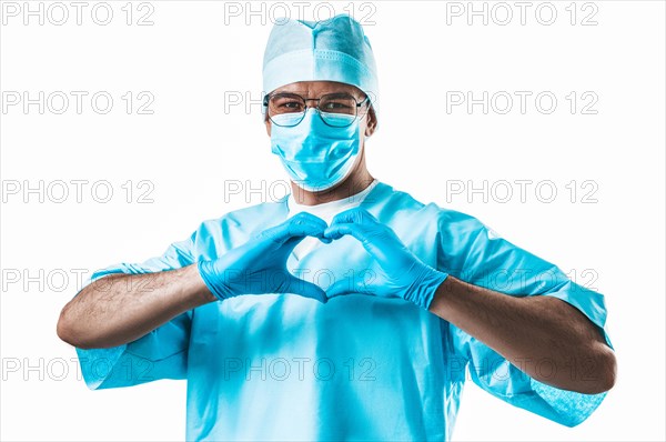 Portrait of a doctor on a white background. He folded his hands in the shape of a heart. Medicine concept.