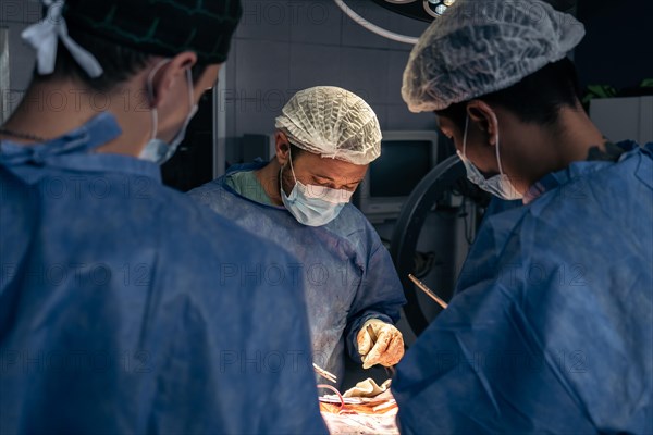 Team of doctors in an operating room. Hospital and operating room