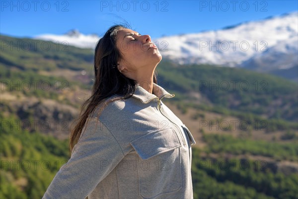 A woman with her eyes closed