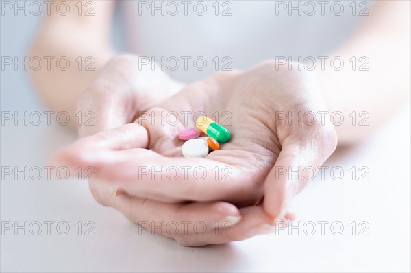 Image of pills on a female palm. The concept of medicine