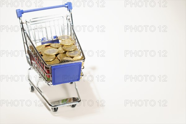 Shopping cart full of euro coins