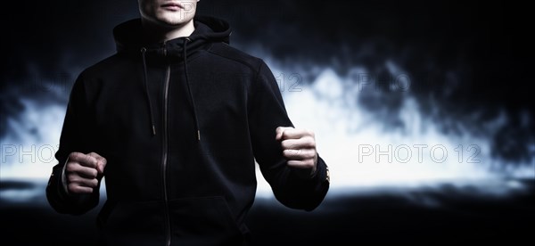 Young kickboxer posing in the studio. The concept of martial arts