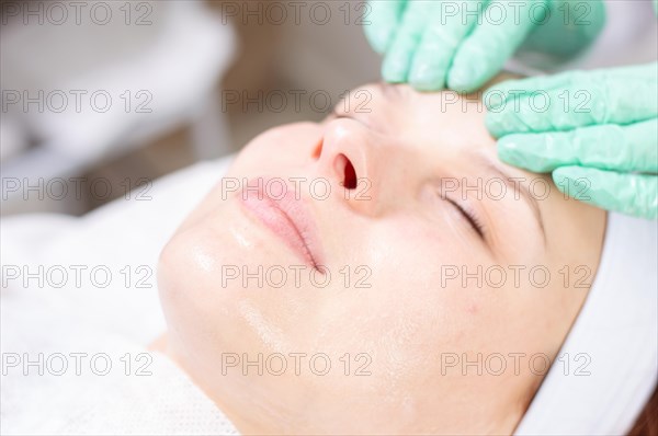 Portrait of a woman's face with problem skin. Peeling procedure. Natural beauty.