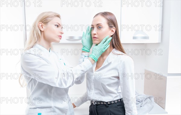 Two girls at the medical center. Consultation on rhinoplasty and blepharoplasty.