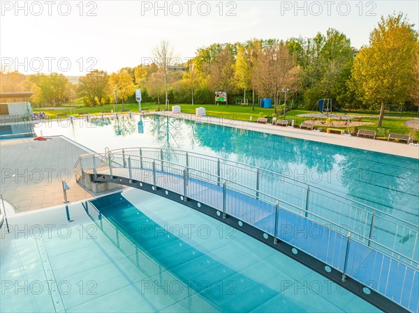 Drone photography of a swimming pool in the early morning fog