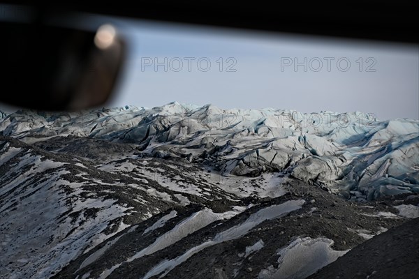View through the windscreen of a bus onto the edge of the ice sheet north-east of Kangerlussuaq