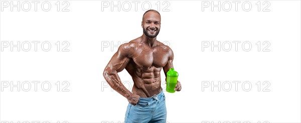 Athlete posing with a shaker in his hand on a white background. Fitness