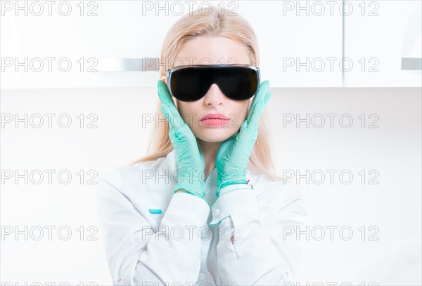 Portrait of a girl in black glasses for laser hair removal. Concept of cosmetology