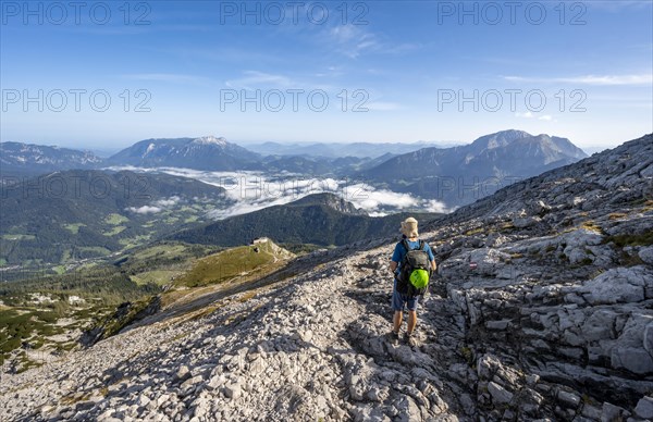 Mountaineer on hiking trail to Watzmann Hocheck summit