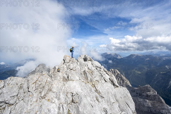 Mountaineer on a narrow rocky ridge