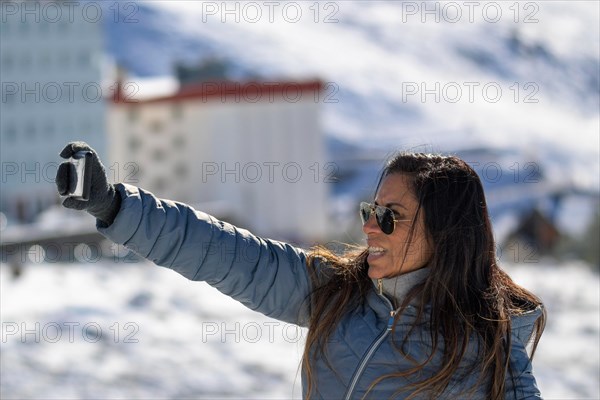 Young man taking a selfie in the mountains of sierra nevada