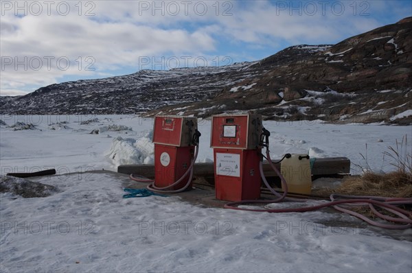 Fuel pumps in winter in the icy harbour