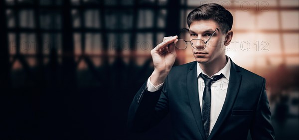 Portrait of a businessman at the airport. He is very unhappy with the flight delay