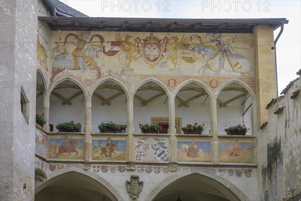 Depiction of a jousting tournament above the arcade
