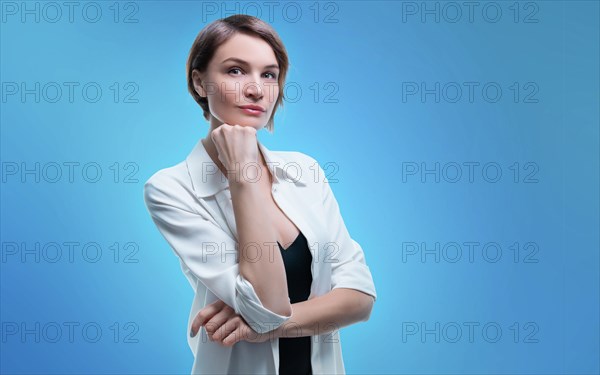 Charming adult business woman with perfect clean skin posing in studio. Skin care concept