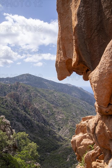 Bright red rock formations of the Calanche above Porto