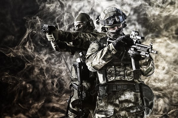 Two special unit soldiers perform a dangerous mission.