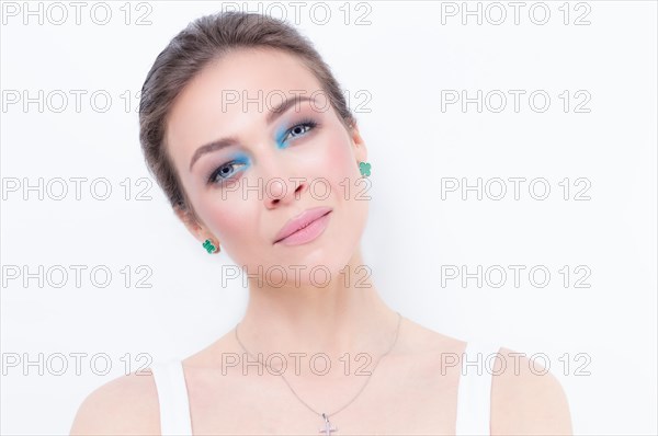 Portrait of a beautiful girl with provocative makeup. White background. Beauty concept. High quality