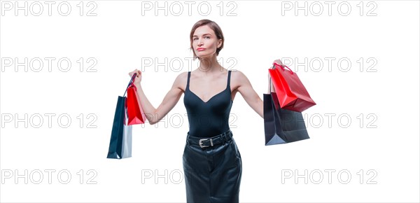Business woman posing in studio with packages with gifts. International women's day concept. Valentine's Day