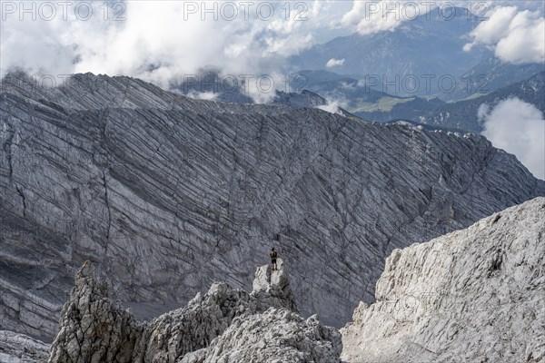 Mountaineer on rocky peak