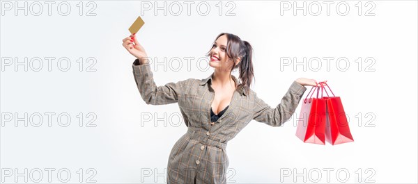 Sexy girl posing with a discount card and red bags. Concept Shopping on Black Friday. White background.