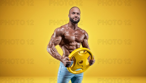 Isolated professional sportsman on a yellow background. Bodybuilding concept. Panorama. Advertising of a gym and sports nutrition.