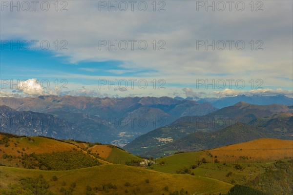 Aerial View over Beautiful Mountainscape with Clouds in a Sunny Day From Monte Generoso