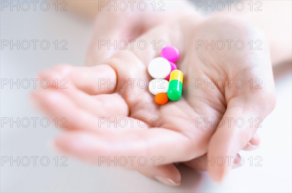 Image of pills on a female palm. The concept of medicine