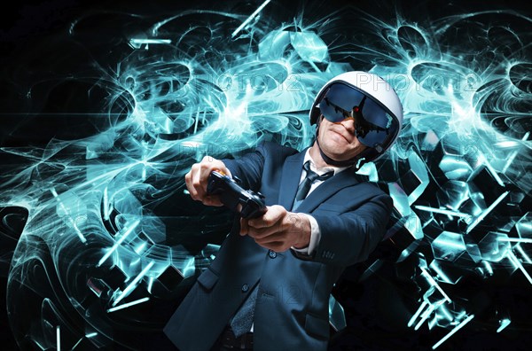 Portrait of a man in a suit and helmet of a pilot with a joystick in his hands. He enthusiastically plays a computer game. Game space. Game concept.