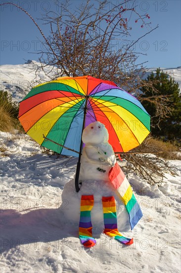 Snowman decorated with umbrella