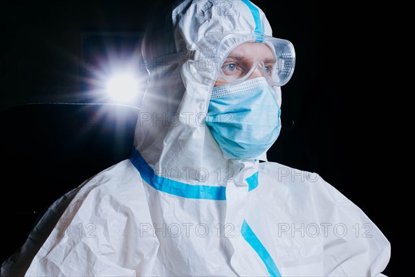 Doctor laboratory assistant in personal protective equipment against coronavirus and medical gloves