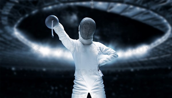 Portrait of a fencer against the backdrop of a sports arena. The concept of fencing.