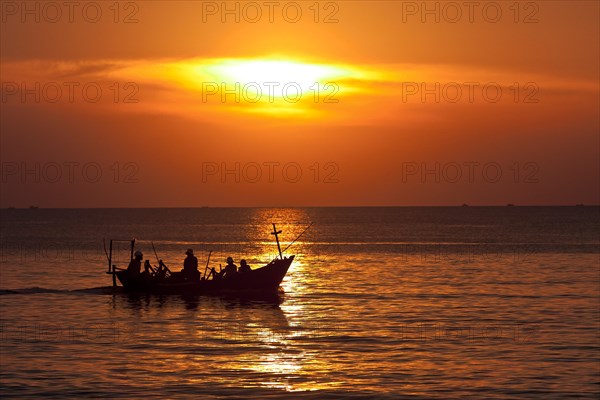 Red sunset and boat