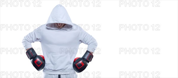 Male trainer posing in the studio with boxing gloves. White hoodie. Mixed martial arts concept. High image quality