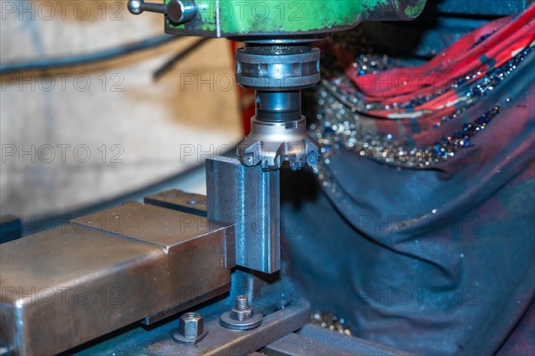 The CNC milling machine cuts the metal parts with a milling machine tool. Numerical control workshop