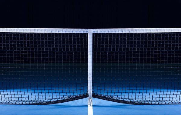 Image of a tennis court with a stretched net. Sports concept.