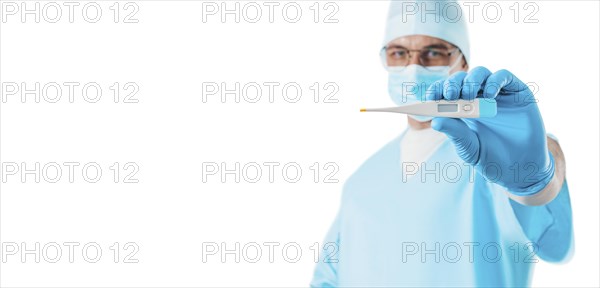 Portrait of a doctor on a white background holding a thermometer. Medicine concept.