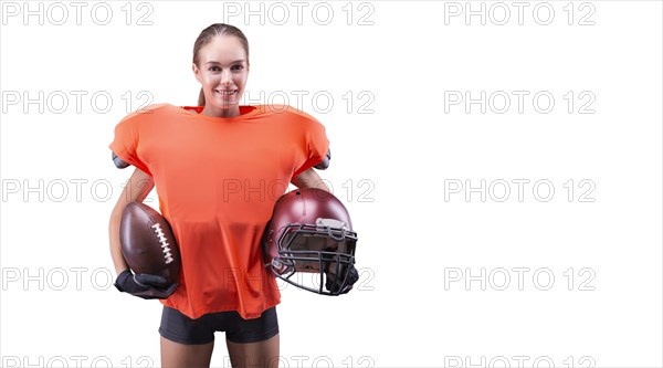 Woman in the uniform of an American football team player posing on a white background. Sports concept.