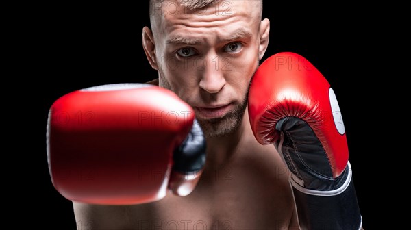 Portrait of a professional boxer. Outstretched fist in a red glove in front of the camera. Boxing concept.