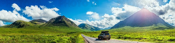 Panorama of Glen Etive and SUV BMW X3 with a roof tent