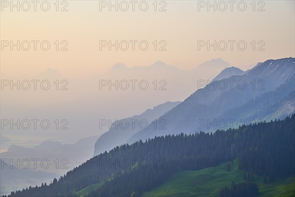 Sunrise over a misty mountain landscape with Eiger