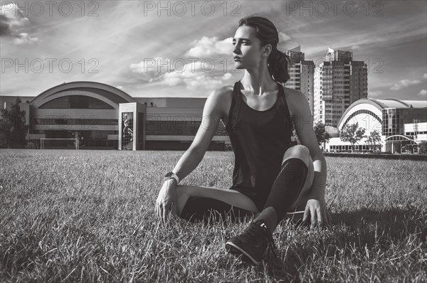 The football player is resting on the football field. Sports concept.