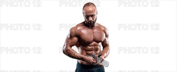 Athlete posing with an athletic belt on a white background. Fitness