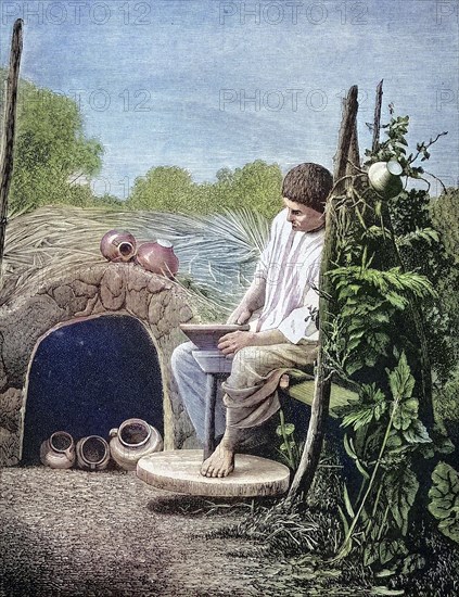 Russian potter at work at the potter's pane