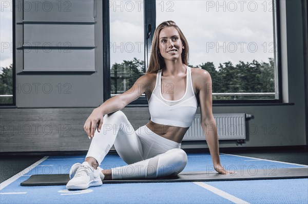 Fitness instructor posing in the gym. Sport concept.